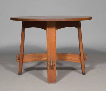 Gustav Stickley Oak #667 Pattern Center Table: Estate / Collection: Property from a Gold Coast Long Island Private Collection With a circular top raised on plank legs joined by an X-form stretcher. Height 29 inches, diameter 40 inches.