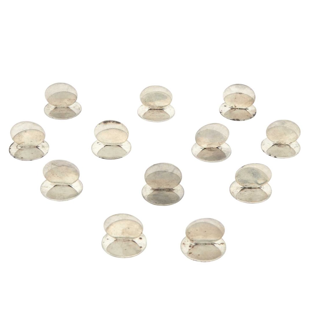 Set of Twelve English Sterling Silver Place Card Holders: Estate / Collection: Property of a New York Gentleman Each circular support on a disc base. Height 1 inch, diameter 1 1/8 inches, total approximately 5 ounces.