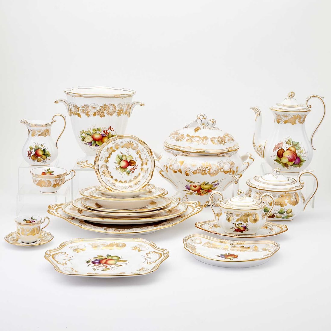 Spode Porcelain “Golden Valley” Pattern Dinner Service: Comprising a vase, height 8 3/4 inches; tureen and under plate; coffee pot; teapot; two cream jugs; covered sugar; covered vegetable dish; two square serving dishes; bread tray; two oval serving bowls
