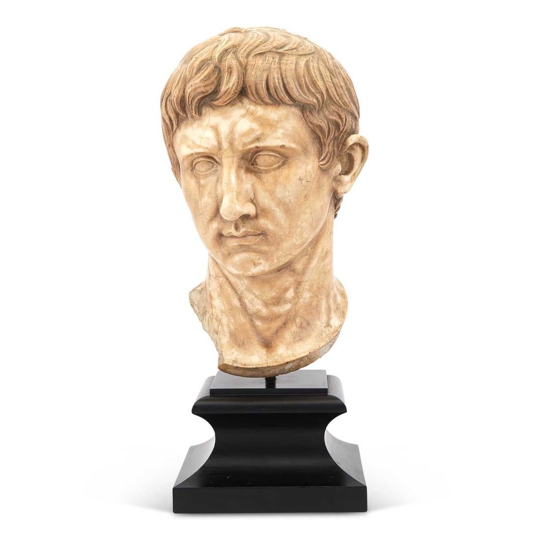 Marble Bust of a Roman Emperor on a Faux Marble Pedestal: Estate / Collection: Collection of Peter van Hattum and Harold Simmons Height of bust 16 inches, height of pedestal 48 1/2 inches.