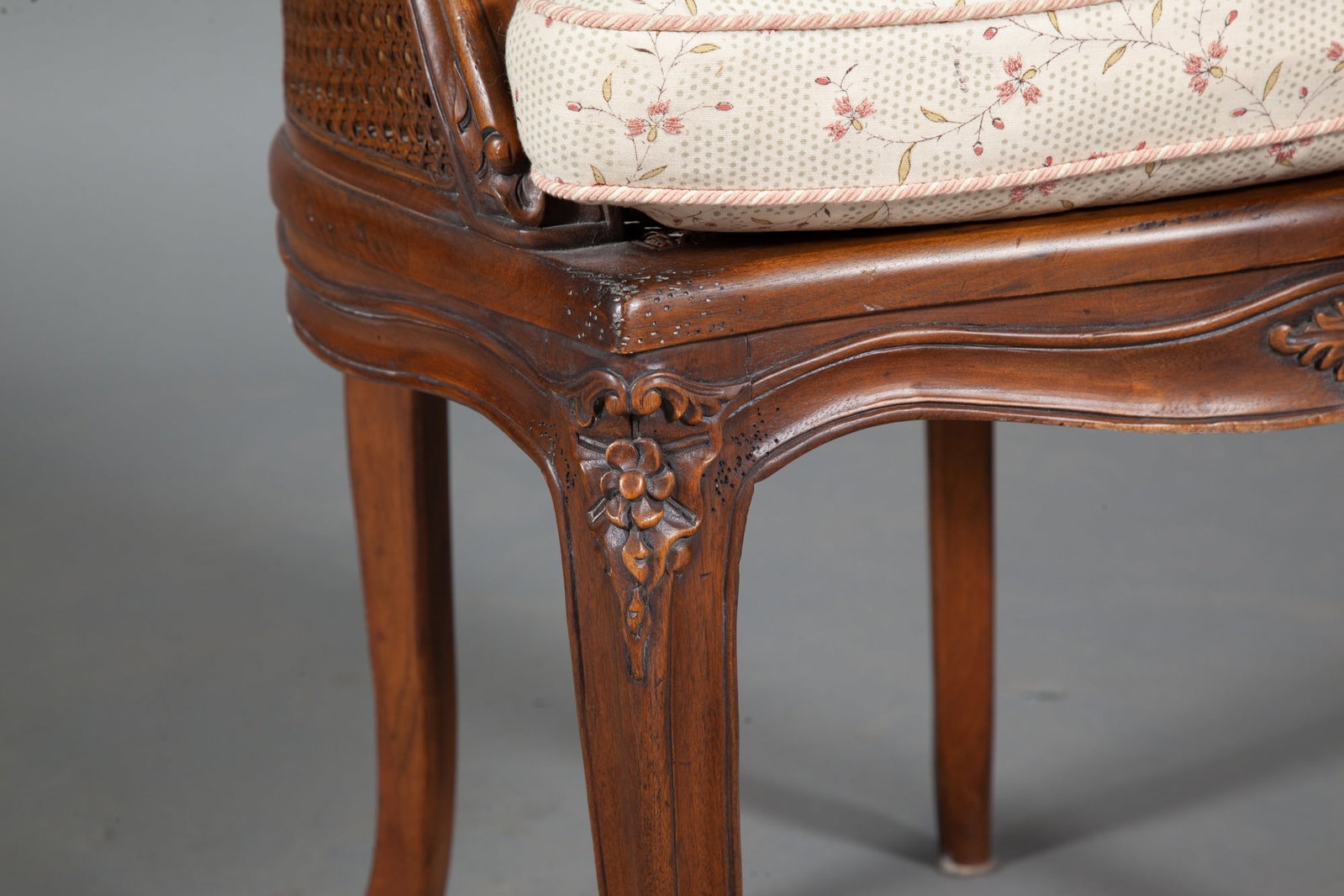 Louis XV Style Fruitwood Bergere with Caned Back and Seat: Height 33 1/2 inches, width 24 1/2 inches, depth of seat 19 inches, height of seat 21 inches.