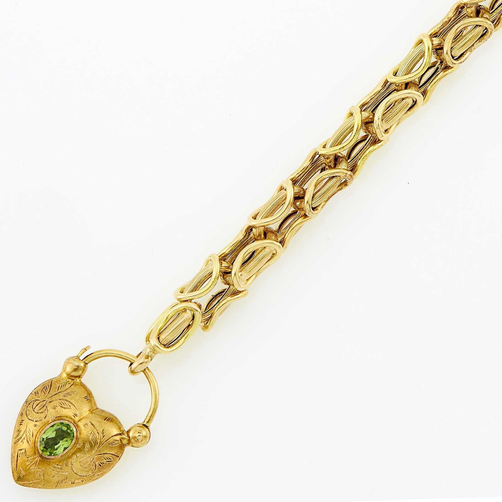 Gold and Peridot Link Charm Bracelet: 14 kt., one oval peridot, ap. 12.7 dwts. Length 8 inches.