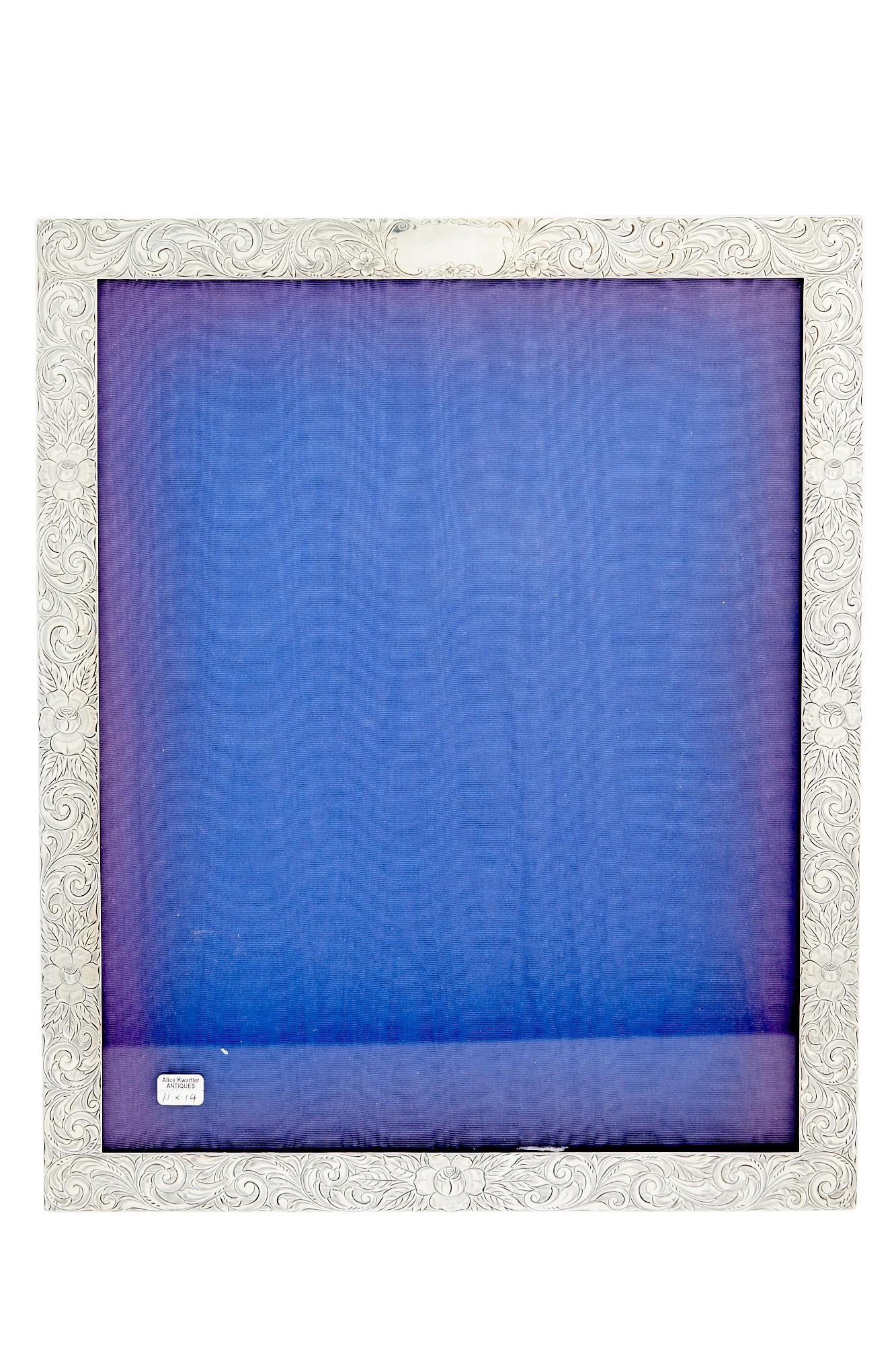American Sterling Silver Oversized Picture Frame Graff, Washbourne & Dunn, early 20th century: Estate / Collection: The Alice Kwartler Collection Rectangular with foliate scroll border. Height 16 1/4 inches, width 13 1/4 inches.