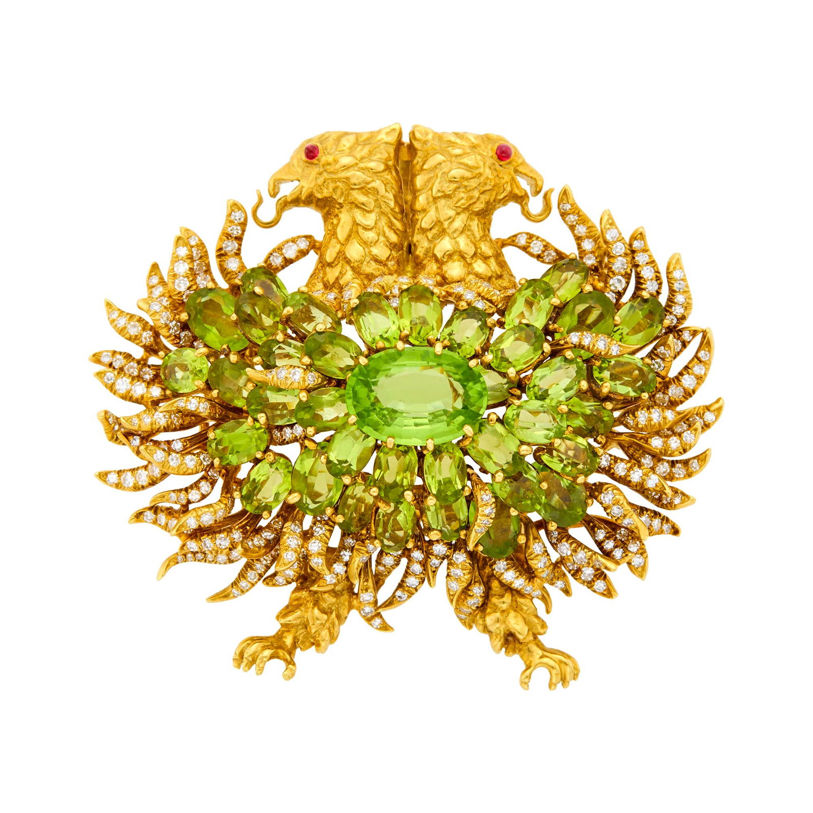 Julius Cohen Gold, Peridot and Diamond Double Griffin Pendant-Brooch: Estate / Collection: The Estate of David Killen One oval peridot ap. 5.50 cts., 37 oval peridots, small single-cut diamonds ap. 3.90 cts., 2 round cabochon ruby eyes, signed Julius Cohen, ap. 27 dwts.