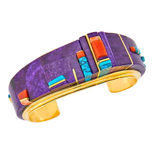 Charles Loloma Gold, Sugilite, Coral and Turquoise Cuff Bangle Bracelet: Vari-shaped sugilite, vari-colored coral, varied shapes of turquoise, signed Loloma, ap. 55.6 dwts. gross. Inner circle 6 inches, with open back. Tests as 18 kt.Sugilite: deep purple with deeper