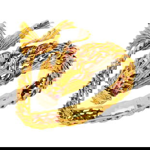 Ilias Lalaounis for Zolotas Two-Color Gold, Diamond and Ruby Fish Bangle Bracelet: 18 kt. yellow and white gold, 59 old-mine and single-cut diamonds ap. .90 ct., signed Ilias Lalaounis, with maker's marks for Lalaounis and Zolotas, obscured, ap. 48.5 dwts. Inner circle 6 1/8 inches.