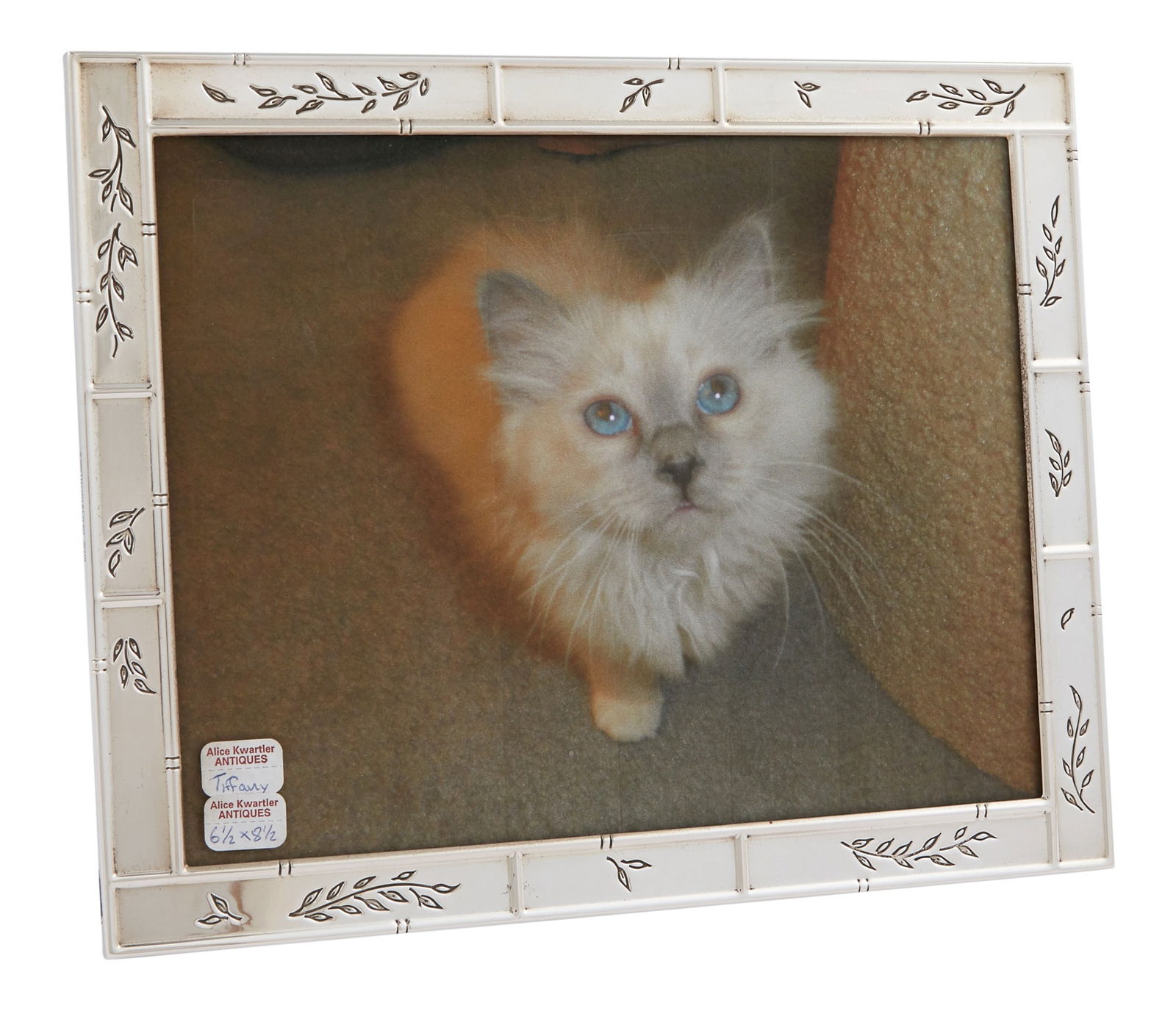Tiffany & Co. Sterling Silver Picture Frame 2002: The paneled frame engraved with leafy branches. Height 10 inches, width 8 inches.