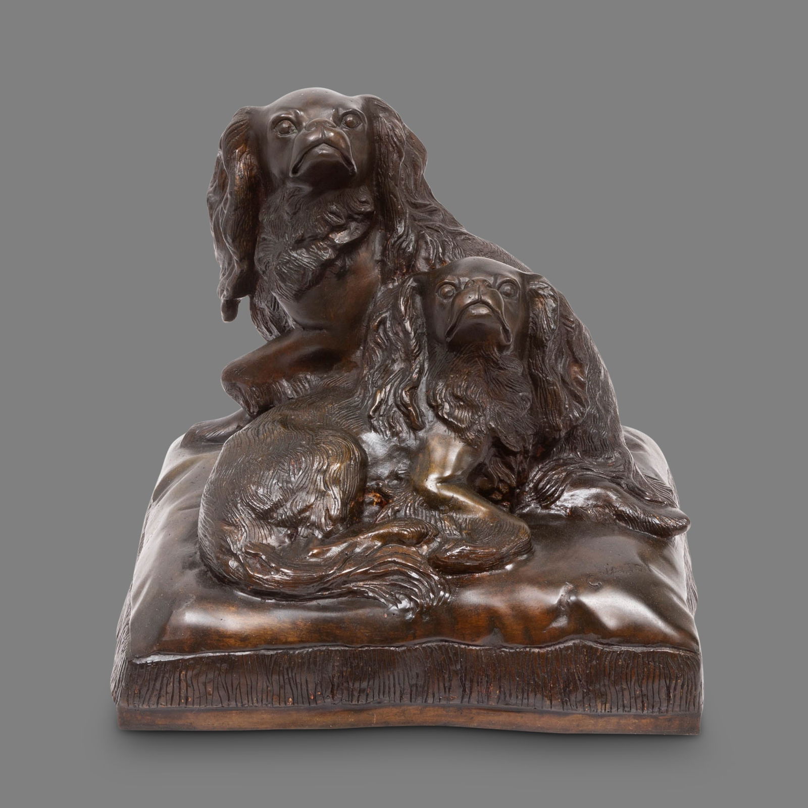 Charles Valton: French, 1851-1918King Charles Spaniels on a CushionSigned VALTON on the pillowBronze with a brown patinaHeight 17 1/2 inches (44.5 cm)