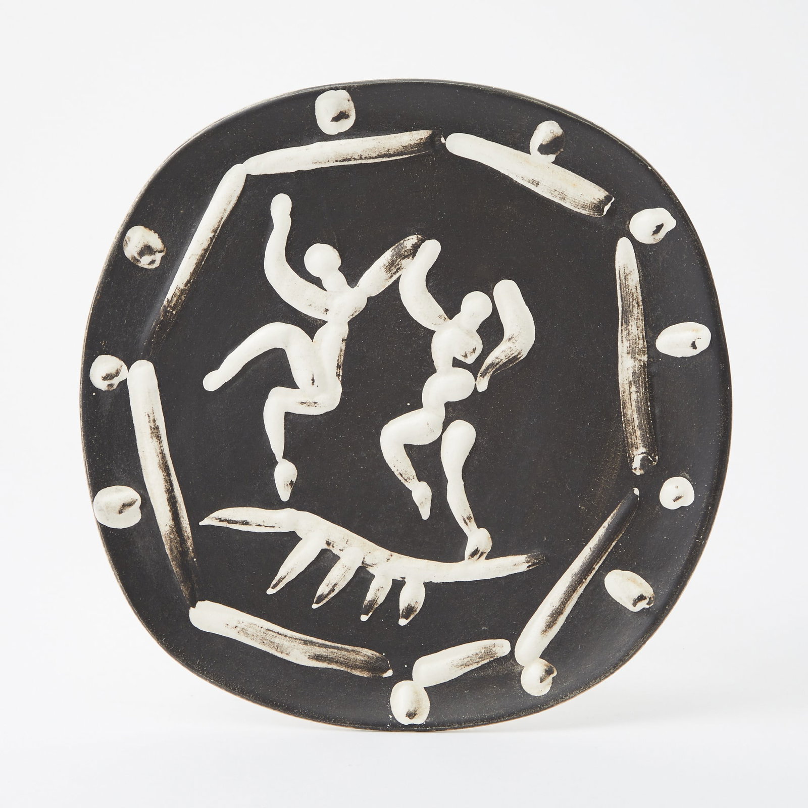 Pablo Picasso (1881-1973): DEUX DANSEURS (ALAIN RAMIÉ 380) Painted and partially glazed white ceramic plate, 1956, from the edition of 450, with the Madoura Plein Feu and Empreinte Originale de Picasso stamps on the revers