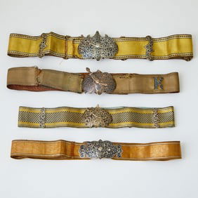 Group of Four Russian Silver and Niello Belt Buckles with Fabric Belts