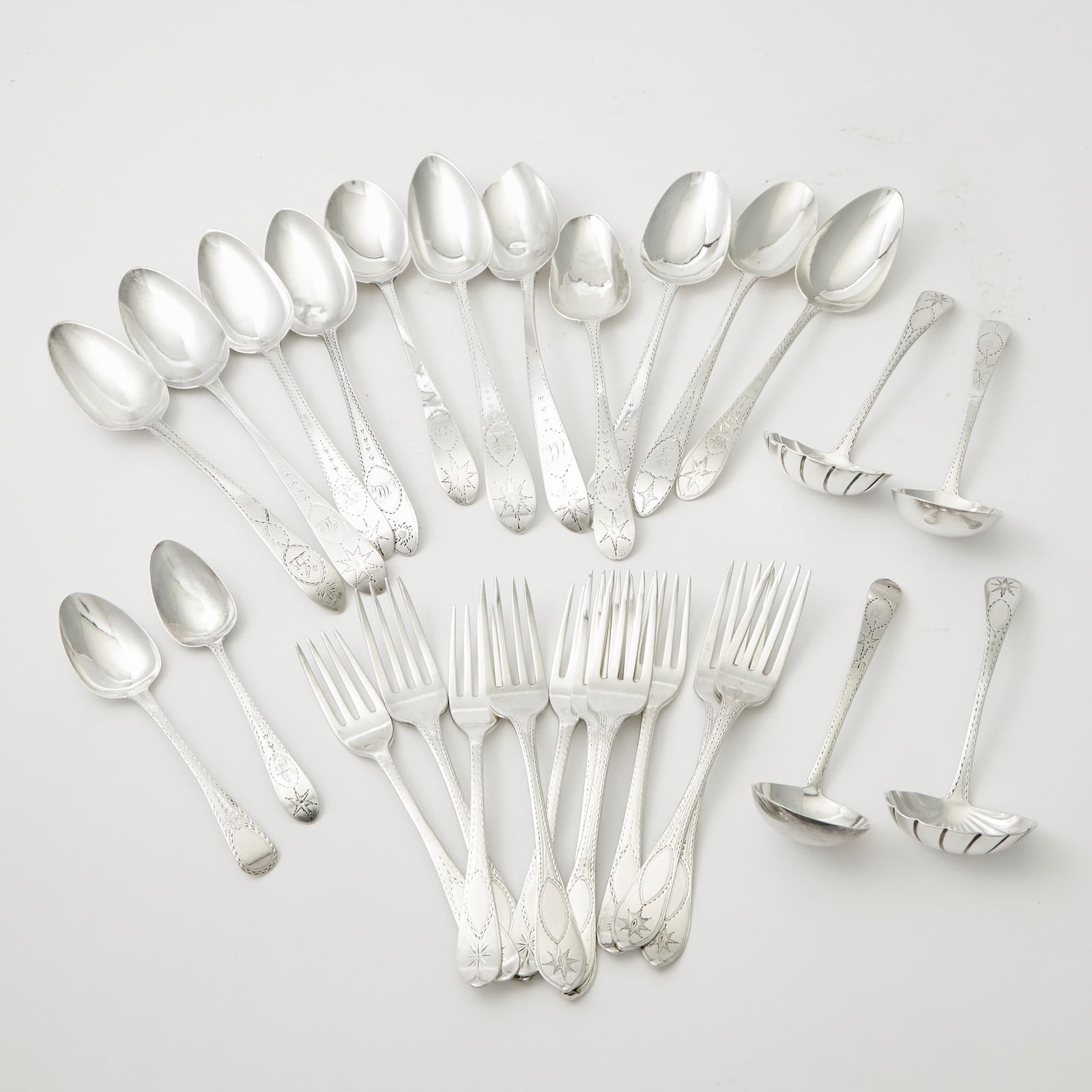 Group of Georgian Irish Sterling Silver Bright Cut Flatware: Comprising:Six dinner forks - John Power, Dublin, 1805/1806Four lunch forks - William Ward, Dublin, 1806Eleven tablespoons - various makers and sizesTwo teaspoons - various makers and sizesPair of sau