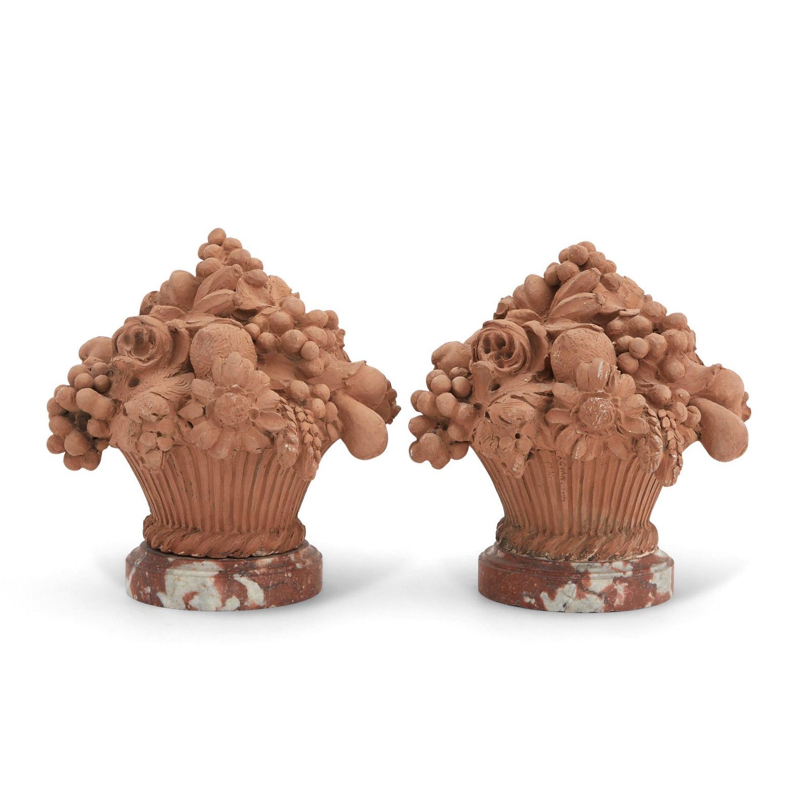 Pair of Terracotta Basket Ornaments: Each flower and fruit filled basket on round marble base; with incised signatures 'Ferland Lion (?)...' and 'F.C. IAN Louis (?)..." Height 10 in (25.4 cm), diameter 9 in (22.8 cm) Dalva Br