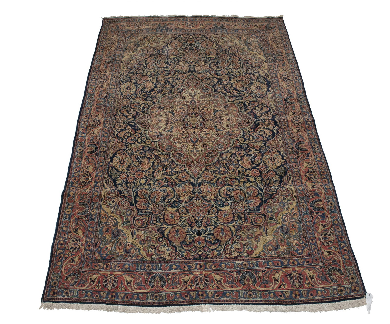 Sarouk Rug: North Iran, Mid-20th Century The midnight blue field with a central pendant medallion flanked by complementary spandrels is within a madder palmette and vine border. (6' 9" x 4' 4")
