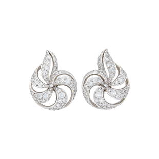 Verdura Pair of Platinum and Diamond 'Nautilus' Shell Earclips: 18 kt., 170 round diamonds weighing 5.99 cts., signed Verdura, ap. 16.8 dwts. With copy of Verdura invoice. Diamonds: G-H-VS.18 kt. white gold clip-backs. 1 1/8 x 7/8 inches.