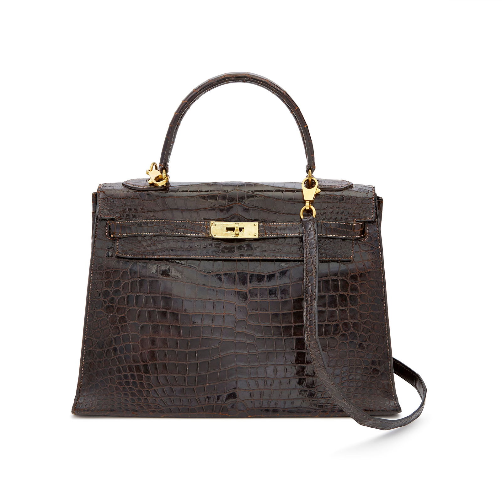 Hermès Dark Brown Alligator 'Kelly 32' Bag: Top handle bag with gold-tone hardware and turn-lock closure, brown leather interior with three slip pockets, signed Hermès, Paris, c. 1964. 12 3/4 x 9 x 4 1/2 inches. With detachable shoulder st