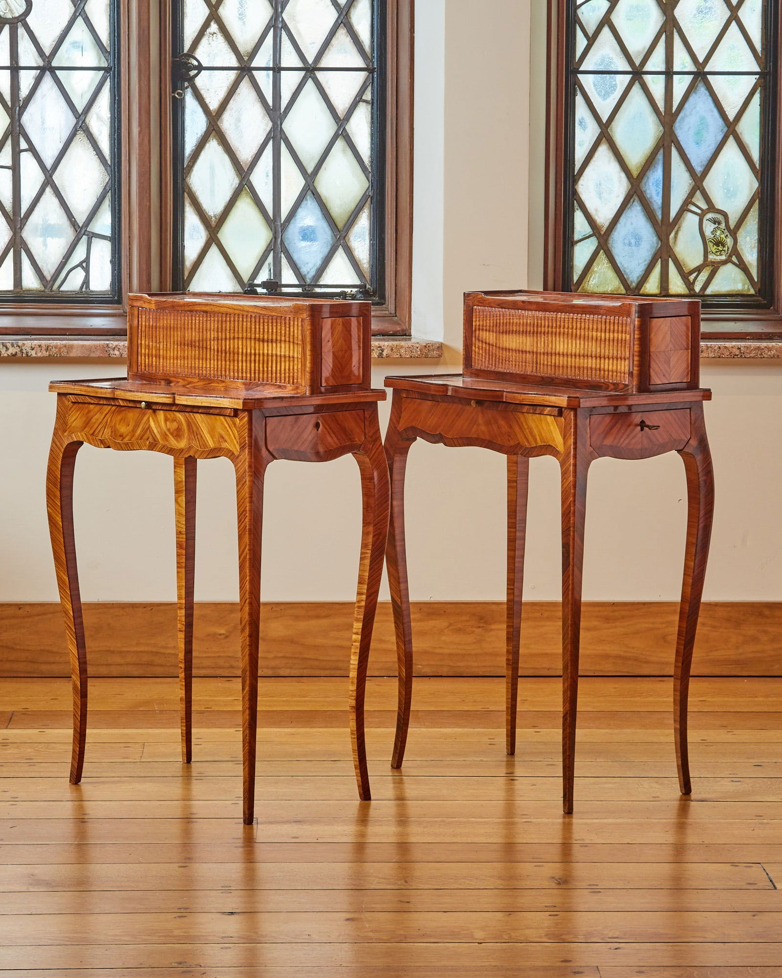 Pair of Louis XV Kingwood and Tulipwood Inlaid Lady's Writing Desks: One signed Roussel. The upper side drawers are released by pushing a hidden button in the back. Height 34 inches, width 21 inches, depth 13 inches.