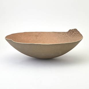 Richard DeVore Glazed Stoneware Center Bowl Last quarter 20th century: Of shallow circular form with an irregular rim, brown and clay colored glaze on the interior, gray colored glaze on the exterior, unmarked, not numbered. Height 5 1/4 inches, width 15 1/4 inches. <