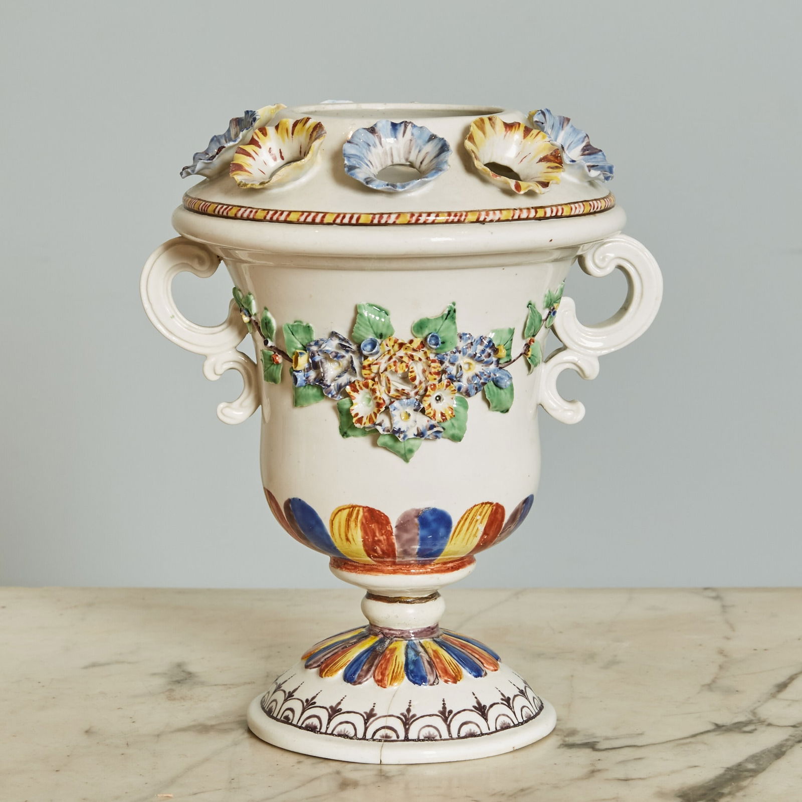 FRENCH PORCELAIN BOUGH POT: Attributed to Chantilly, circa 1760 Of two-handled krater form, the shoulder with large central aperture encircled by ten smaller apertures, each as the center of an applied open flower blossom, the C