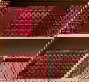 A group of finely bound books, mostly in red leather