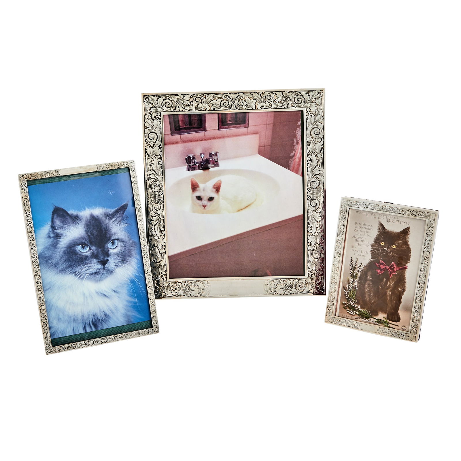 Three Graduated American Sterling Silver Picture Frames 20th Century: Height of largest 10 inches, width 8 1/4 inches; height of middle 8 1/4 inches, width 5 1/4 inches; height of smallest 6 inches, width 4 1/4 inches.
