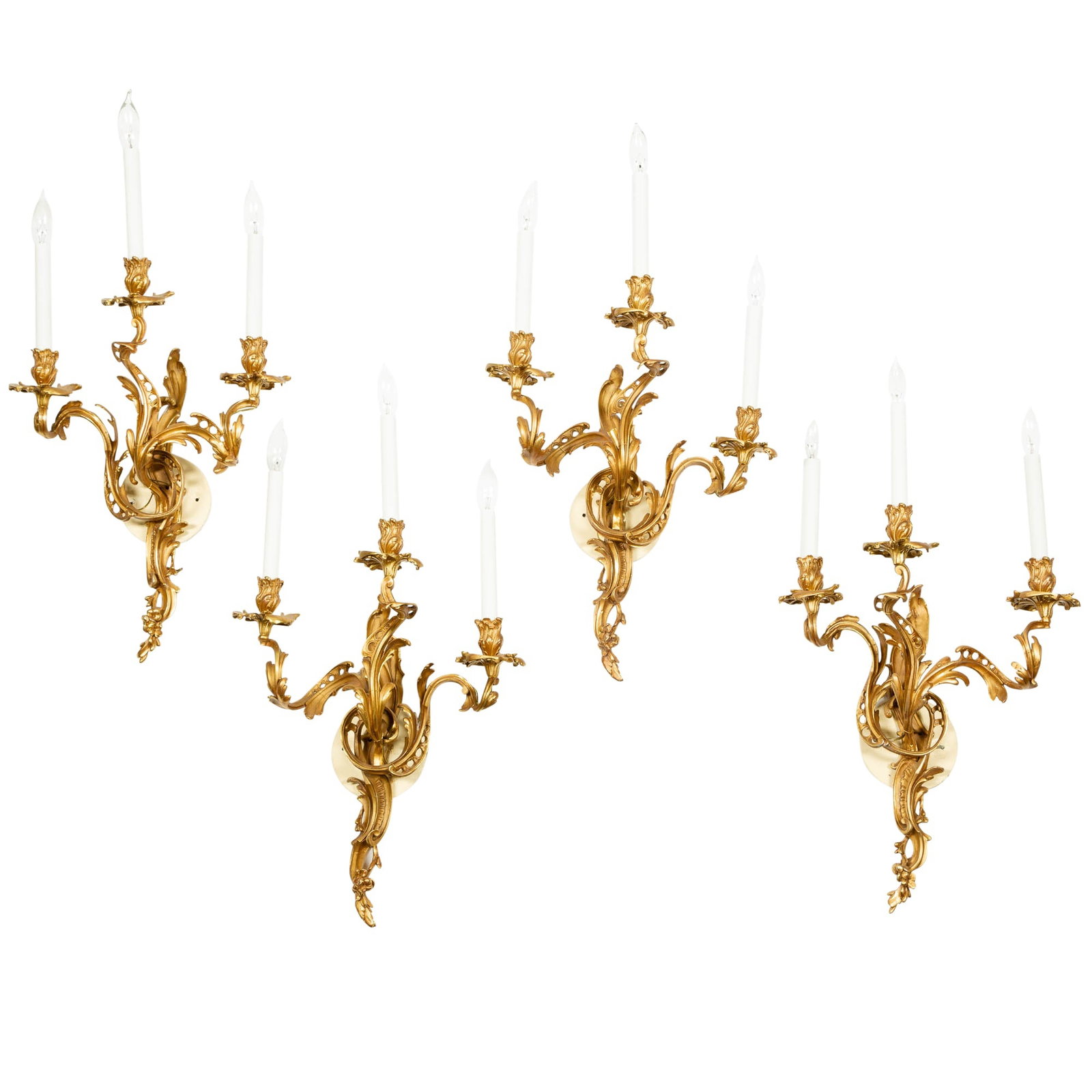 Set of Four Louis XV Style Gilt-Bronze Three-Light Sconces: Height 23 inches, width 14 inches.