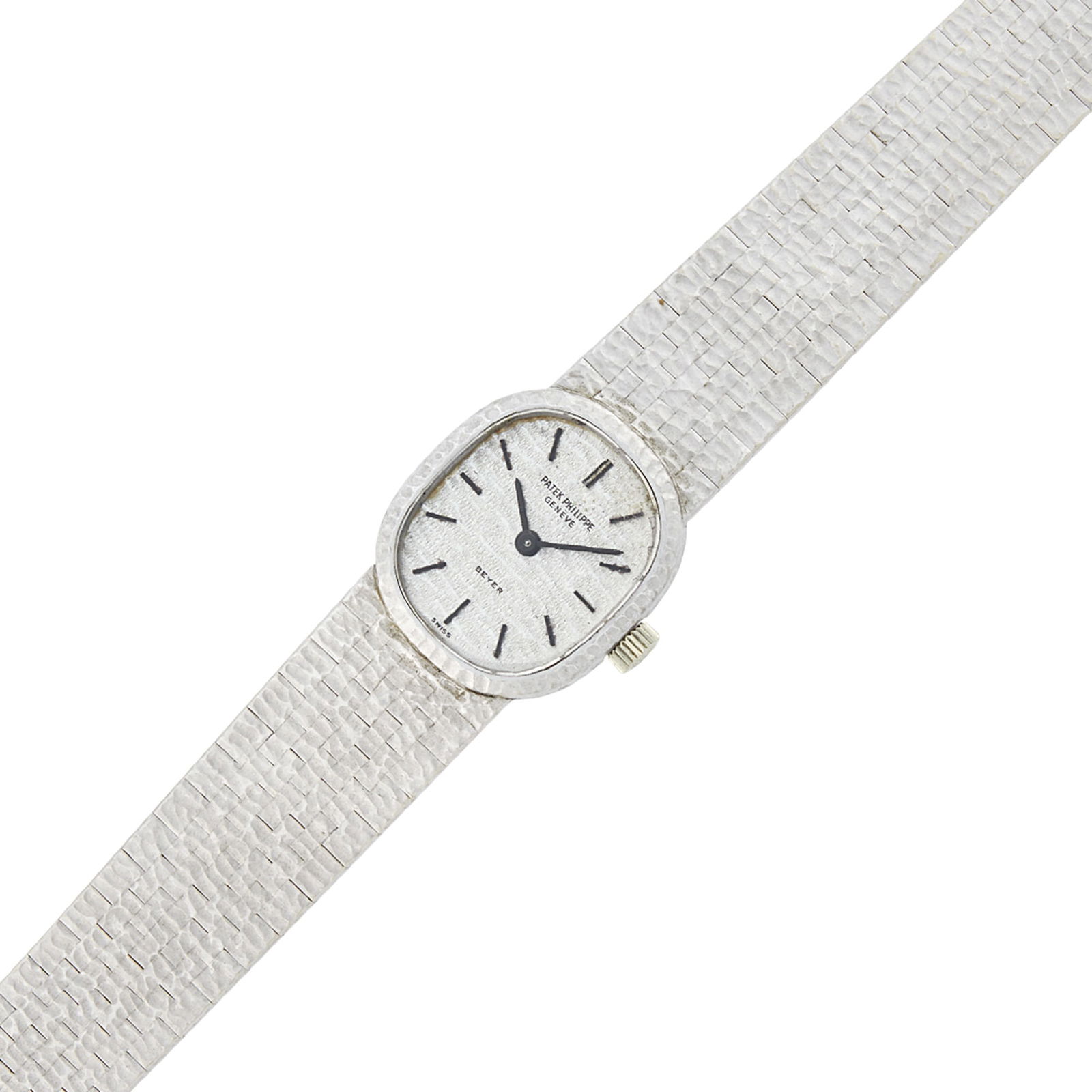 Patek Philippe White Gold Wristwatch: 18 kt., mechanical, cushion-shaped textured dial with baton markers, case dia. ap. 19 x 17 mm., bark-textured bracelet with fold-over clasp, dial, movement, case and clasp signed Patek Philippe, movem