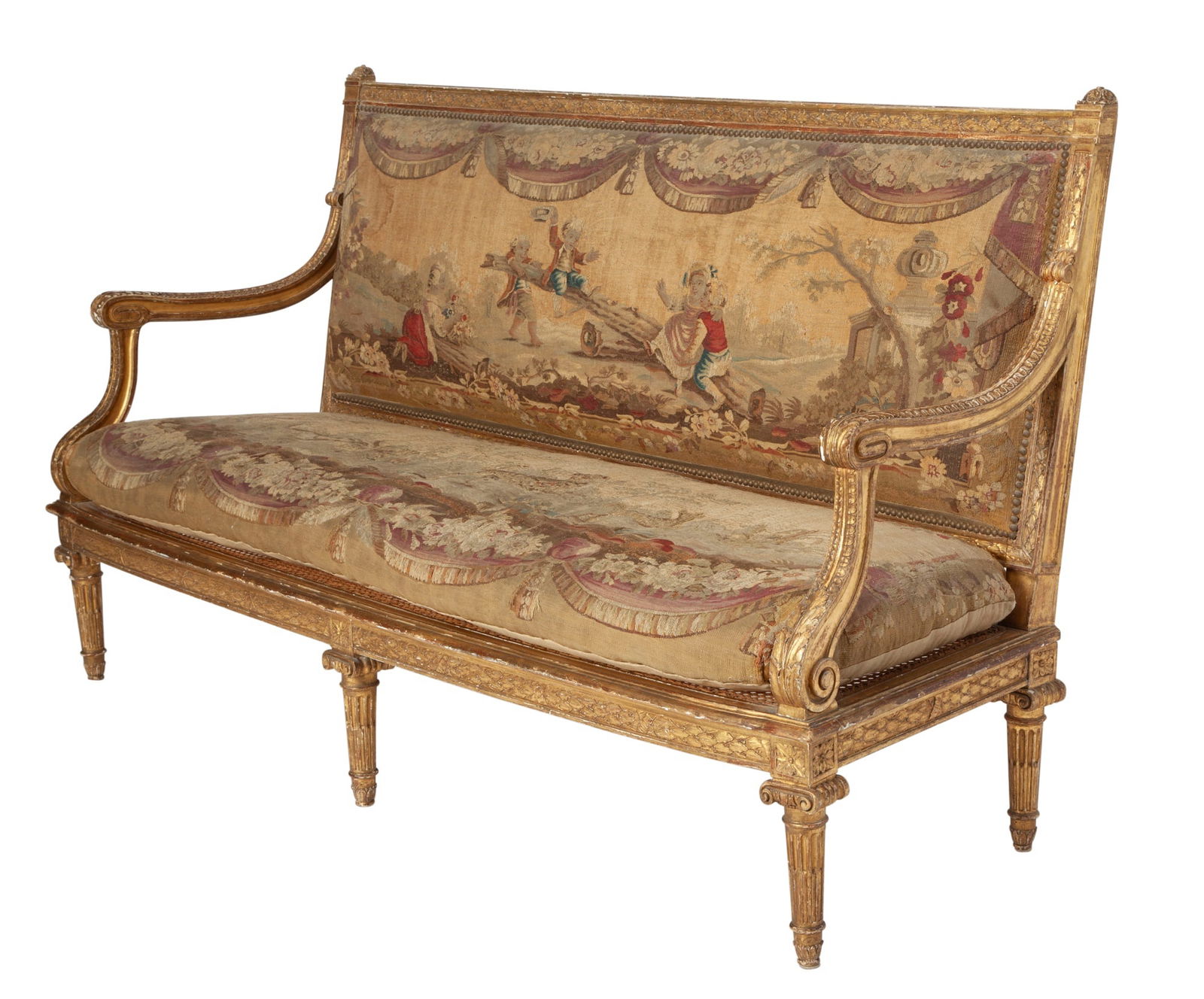 Louis XVI Style Aubusson Tapestry-Upholstered Giltwood Settee: Partially composed of older elements, the padded rectangular back upholstered with a tapestry of children at play within a frame carved with garlanded berried leaves flanked by acanthus-carved arms an