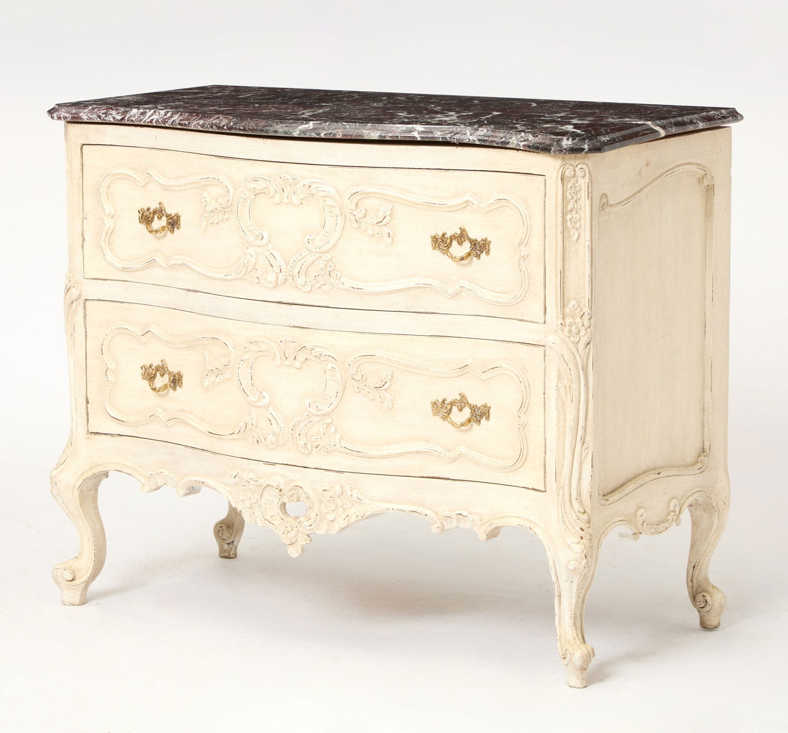 Regence Style Carved Commode with a Marble Top Late 20th Century: Serpentine shaped with two drawers. Painted in a glazed white finish with a marble top, Height 30 inches, Depth 18 1/2 inches, Width 36 1/2 inches Front right corner of marble is cracked