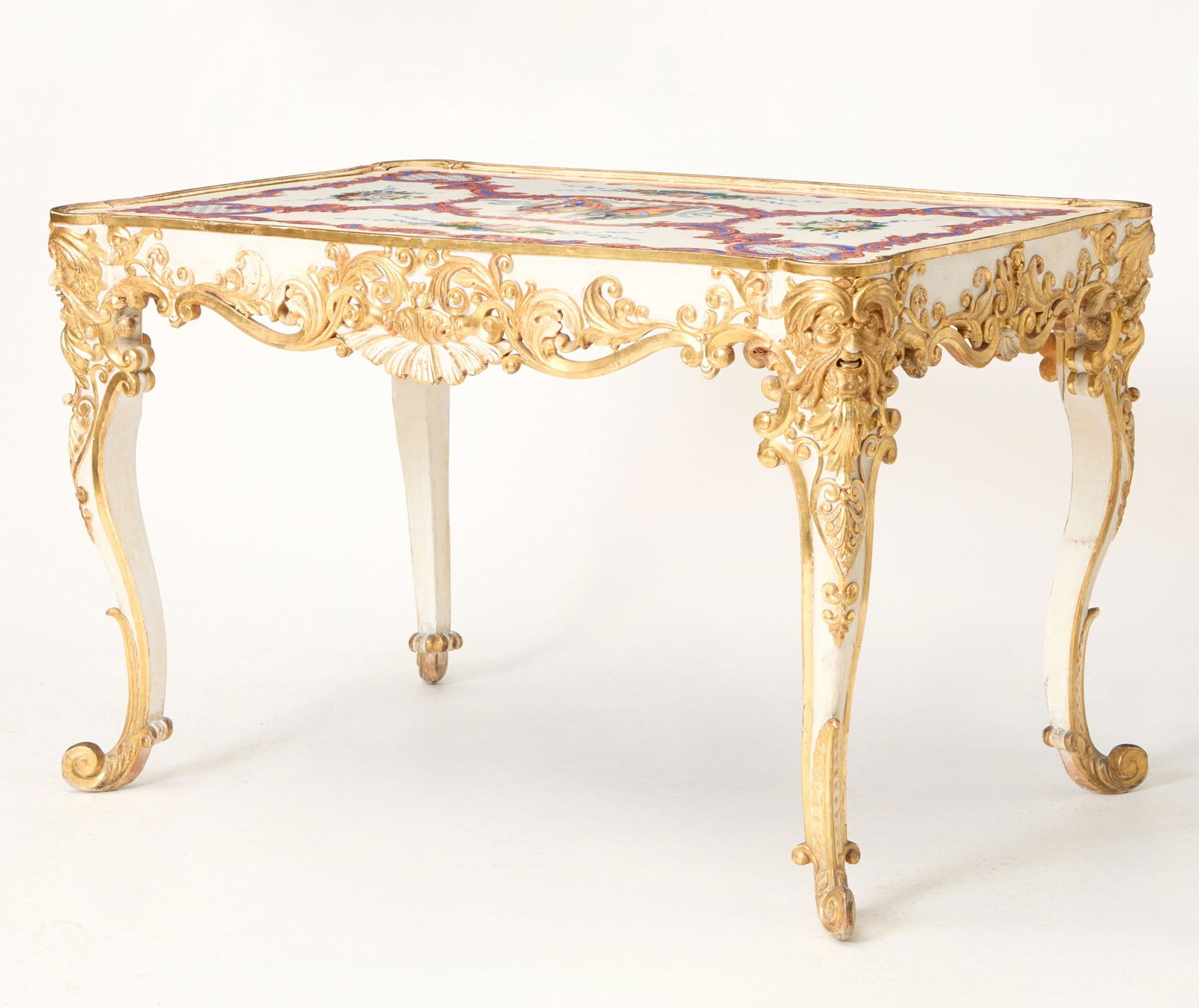 Italian Painted and Parcel Gilt Table with a Painted Alabaster Top Early 20th Century.: The top by Pietro delle Valle e Fratelli, Livorno, Italy, label underneath. Height 31 1/2 inches, width 49 inches, depth 32 inches. (h 31 1/2, w 49. d 32) Fremontier, Paris.