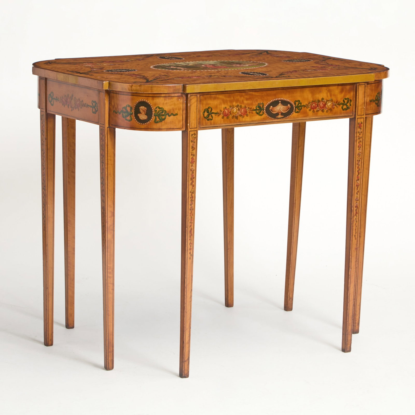 George III Style Painted Satinwood Table Circa 1900: With one drawer, the painted decoration in the style of Angelica Kauffman with Diana and Cherubs. Height 29 1/2 inches, width 34 3/4 inches, depth 25 7/8 inches. cracking amd scratches to top, c