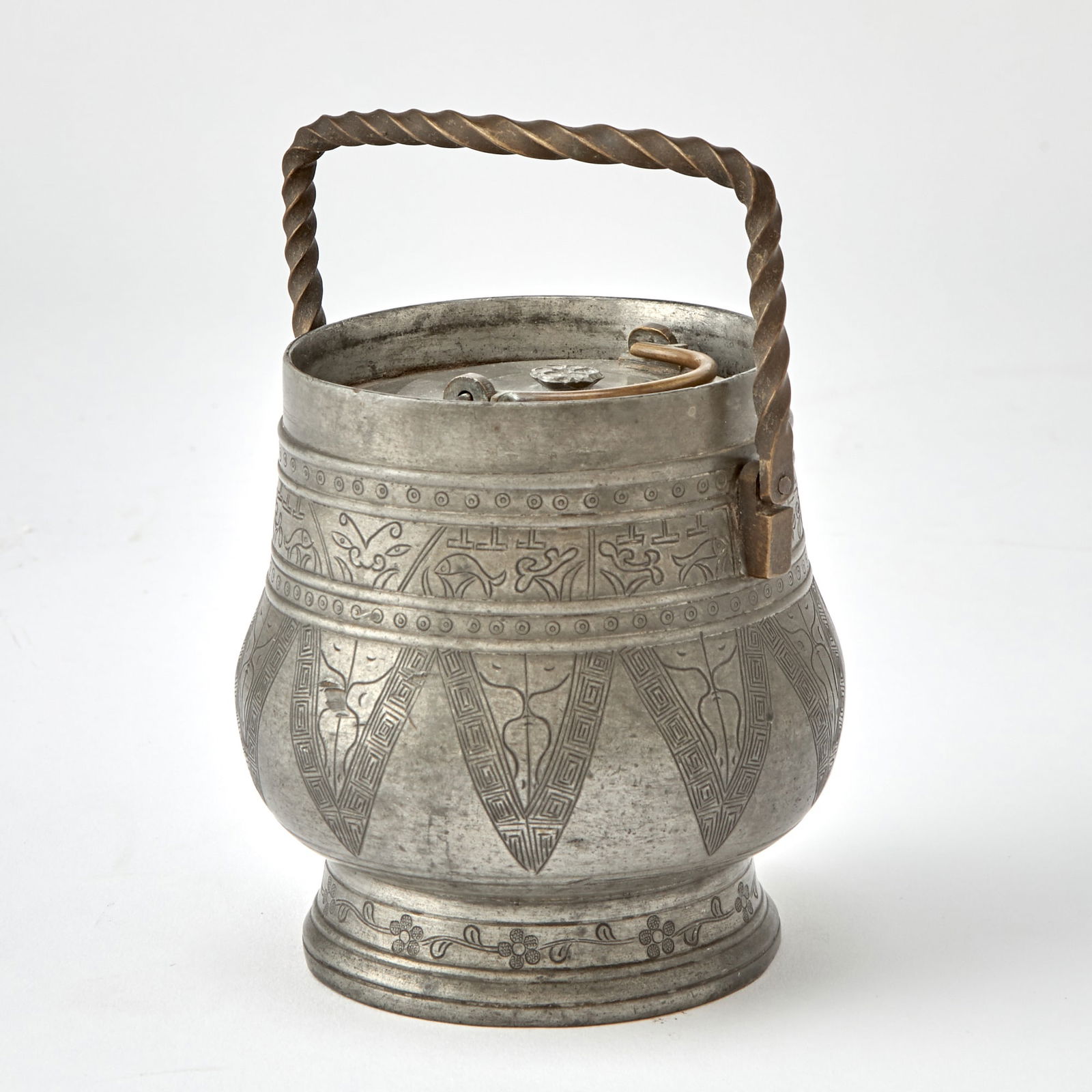 A Chinese Pewter Wine Warmer 19th Century: Of archaistic hu form, decorated with incised stylized borders to body and foot. (Height 4 1/4 inches)