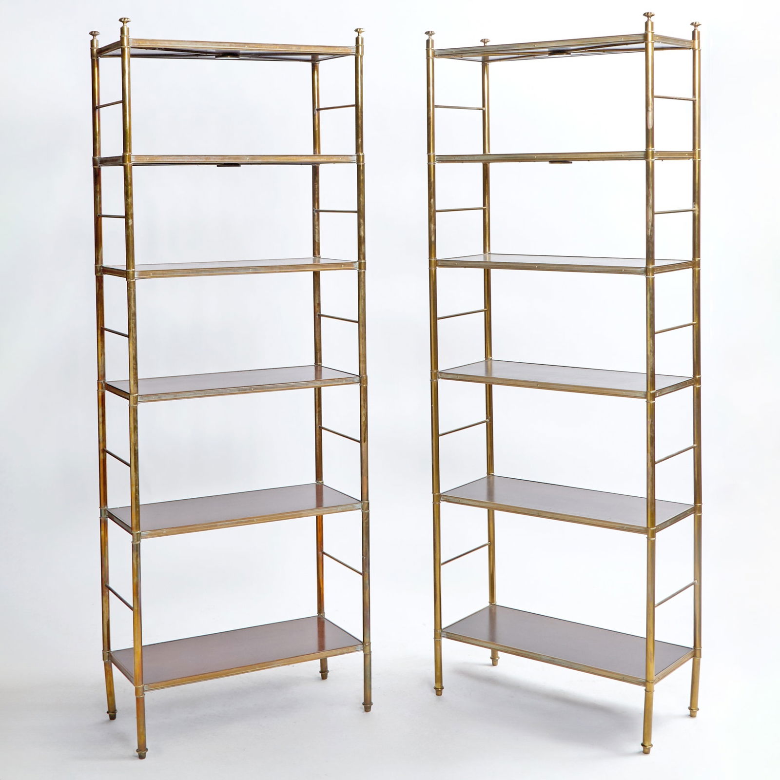 Pair of Patinated Brass and Mahogany Étagères Mid-20th century, after a design by (1 of 3)