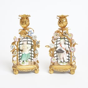 Pair of Meissen Porcelain Figural Gilt-Bronze Arcade and Tole Branch Chambersticks The porcelain