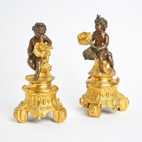 Pair of Louis XV Style Patinated and Gilt Bronze Figures of Putti