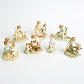 Seven Meissen Porcelain Figures and Figure Groups of Putti Late 19th century, blue crossed swords