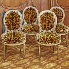 Set of Four Louis XVI Upholstered Painted and Parcel Gilt Side Chairs