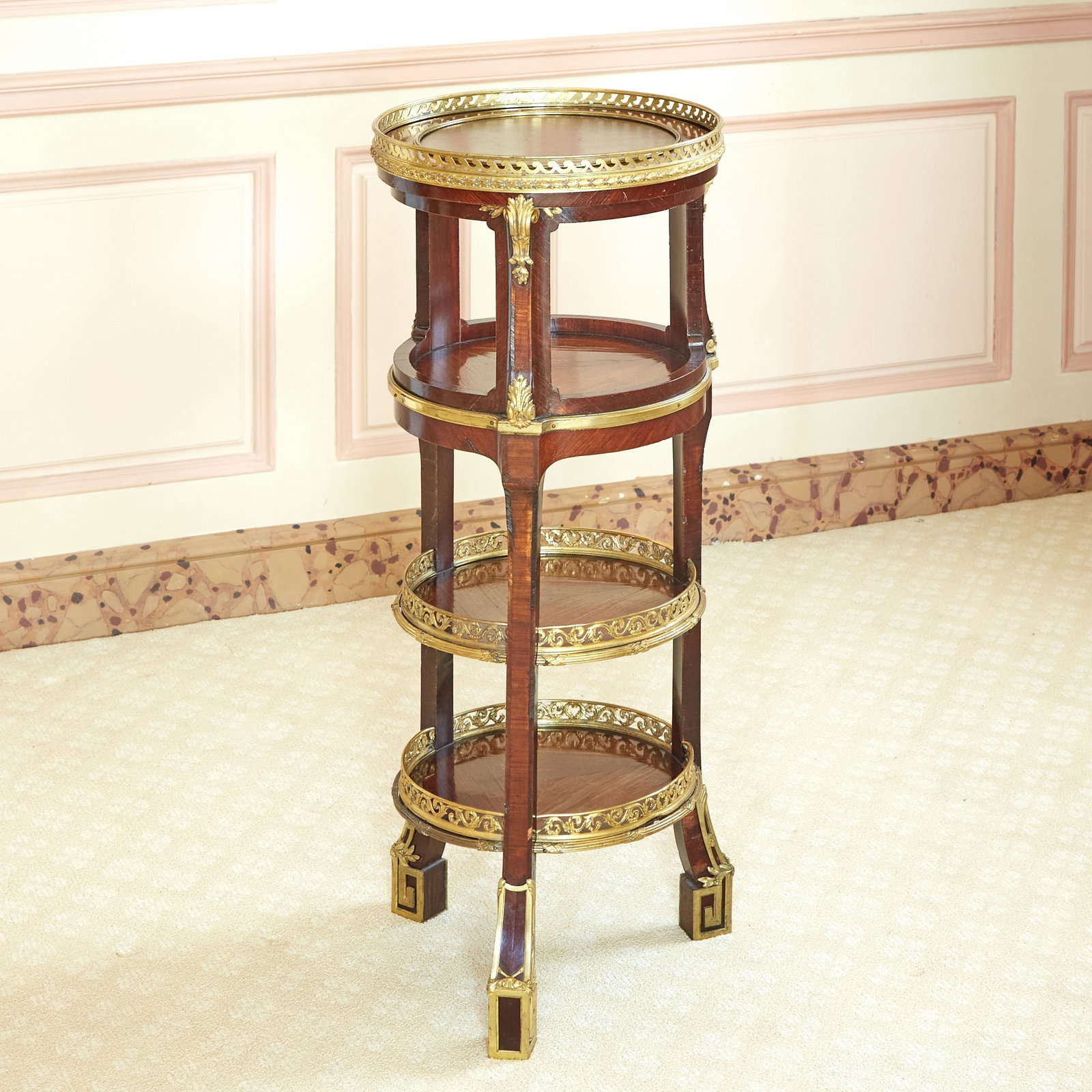 Louis XVI Gilt Bronze Mounted Kingwood Galleried Multi-Tiered Gueridon: Estate / Collection: Property of a Fifth Avenue Philanthropist Circular with four galliered tiers, raised on block scroll feet. Height 31 1/2 inches (80 cm), diameter 12 inches (30.5 cm).
