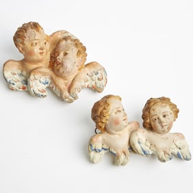 Two Neapolitan Polychrome Decorated Terracotta Busts of Putti