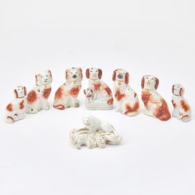Bloor Derby Porcelain Model of a Poodle and Seven Staffordshire Models of King Charles Spaniels The