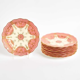 Twelve Royal Crown Derby Porcelain Gilt-Decorated Pink-Ground Plates