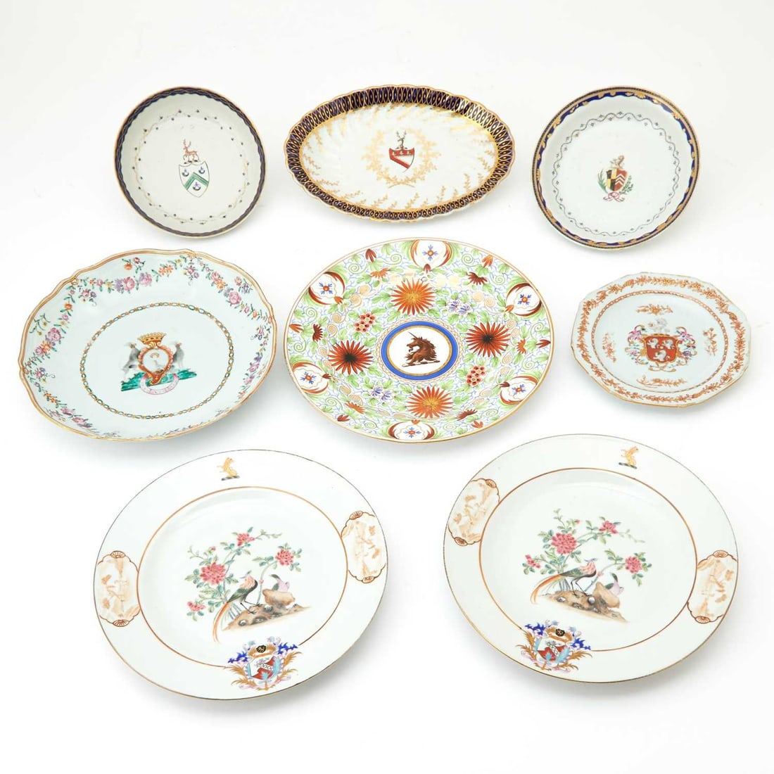 Eight Porcelain Armorial Dishes: Estate / Collection: Property of a Fifth Avenue Philanthropist Comprising a plate enameled with the armorial of Aguado de las Marismas family (Spain) with two black greyhoun