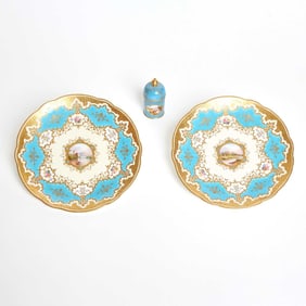Two Coalport Porcelain Turquoise-Ground ‘Jeweled’ Landscape Cabinet Plates