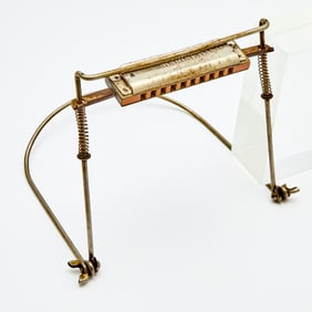 A harmonica and holder used by Bob Dylan in 1961, his first year in New York City