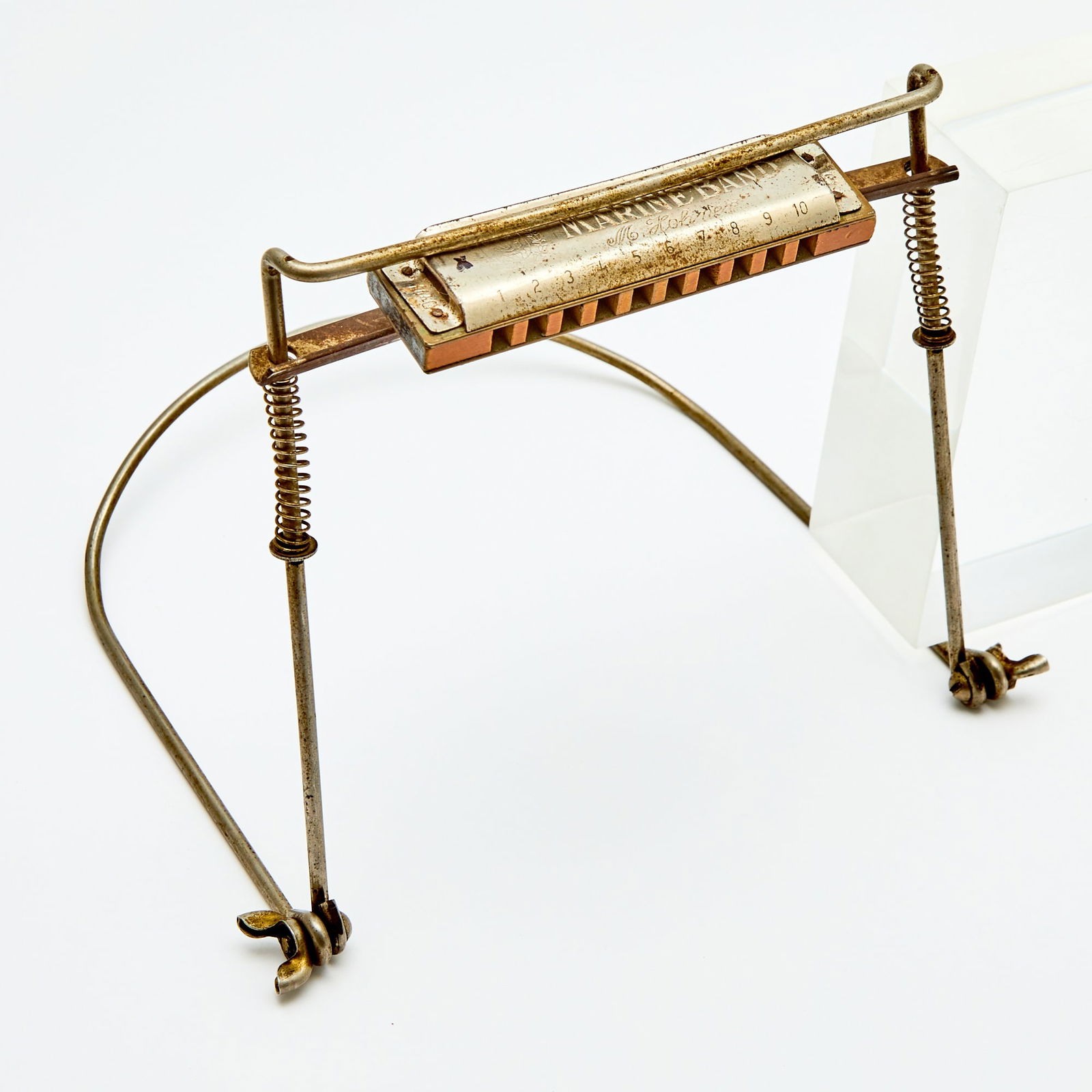 A harmonica and holder used by Bob Dylan in 1961, his first year in New York City: BOB DYLAN A harmonica holder and Hohner Marine Band harmonica reportedly used by Bob Dylan in 1961. The harmonica holder reportedly the one used by Dylan at his first paying gig at Gerde's Folk City o