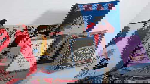 A Group of Needlepoint Pillows Embroidered with Jerry Herman Musicals