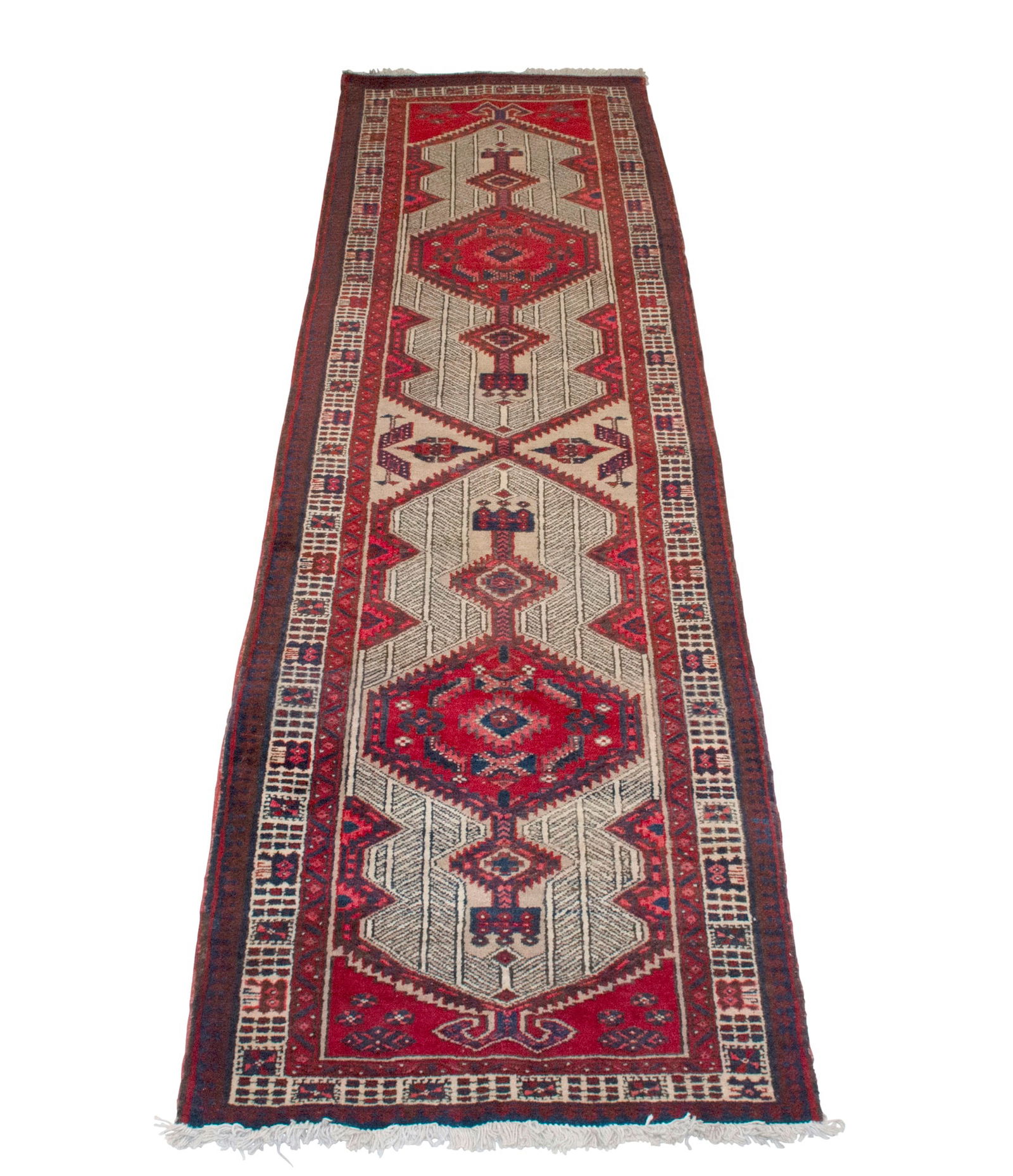 Serab Runner: Estate / Collection: From a Private Collection in New York City Northwest Iran, Circa 1975 Two serrated hexagonal pole medallions on the ivory field are within a rosette border. 11' 0" x 3' 1"
