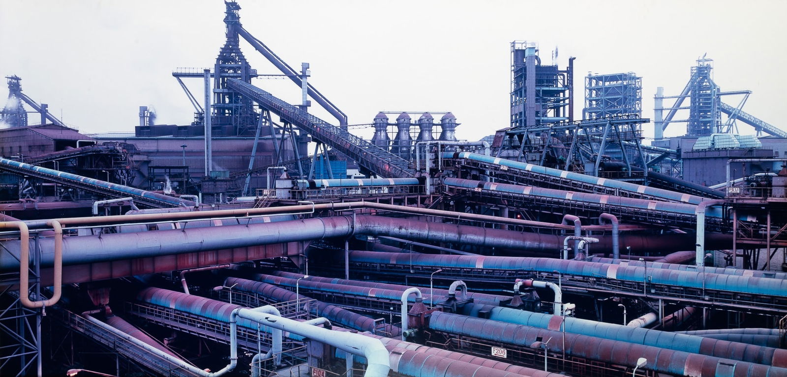 Edward Burtynsky, Bao Steel #4, Shanghai, China, 2005: BURTYNSKY, EDWARD (b. 1955) Bao Steel #4, Shanghai, China, 2005. Chromogenic print, 30 x 60 inches, signed, titled, dated and editioned 3 from the edition of nine verso. Fading, tones shifted towards