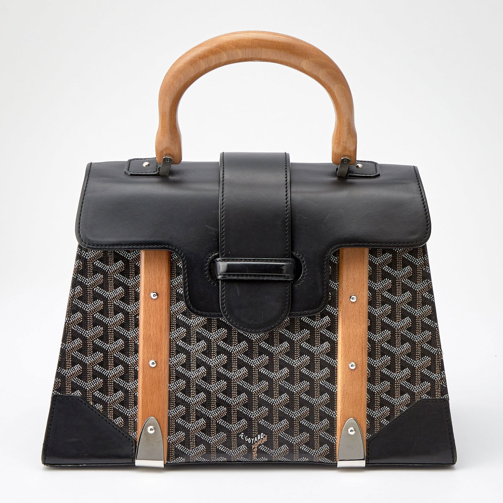 Goyard Goyardine Saigon MM Bag: Wood top handle and trim, silver-tone hardware, printed coated canvas with smooth black leather front flap and side pannels, mustard yellow fabric interior with one side zippered compartment, signed G