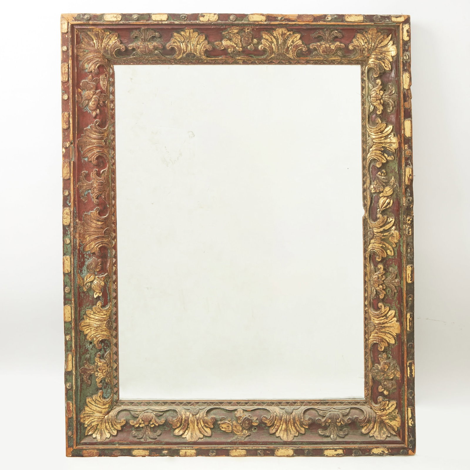 Italian Baroque Style Parcel-Gilt and Painted Frame: Estate / Collection: The Collection of Joanne B. Breyer The rectangular frame boldly carved with acanthus highlighted in gilt on a brown ground, with later mirror plate. Height 47 inches, width 37 inc