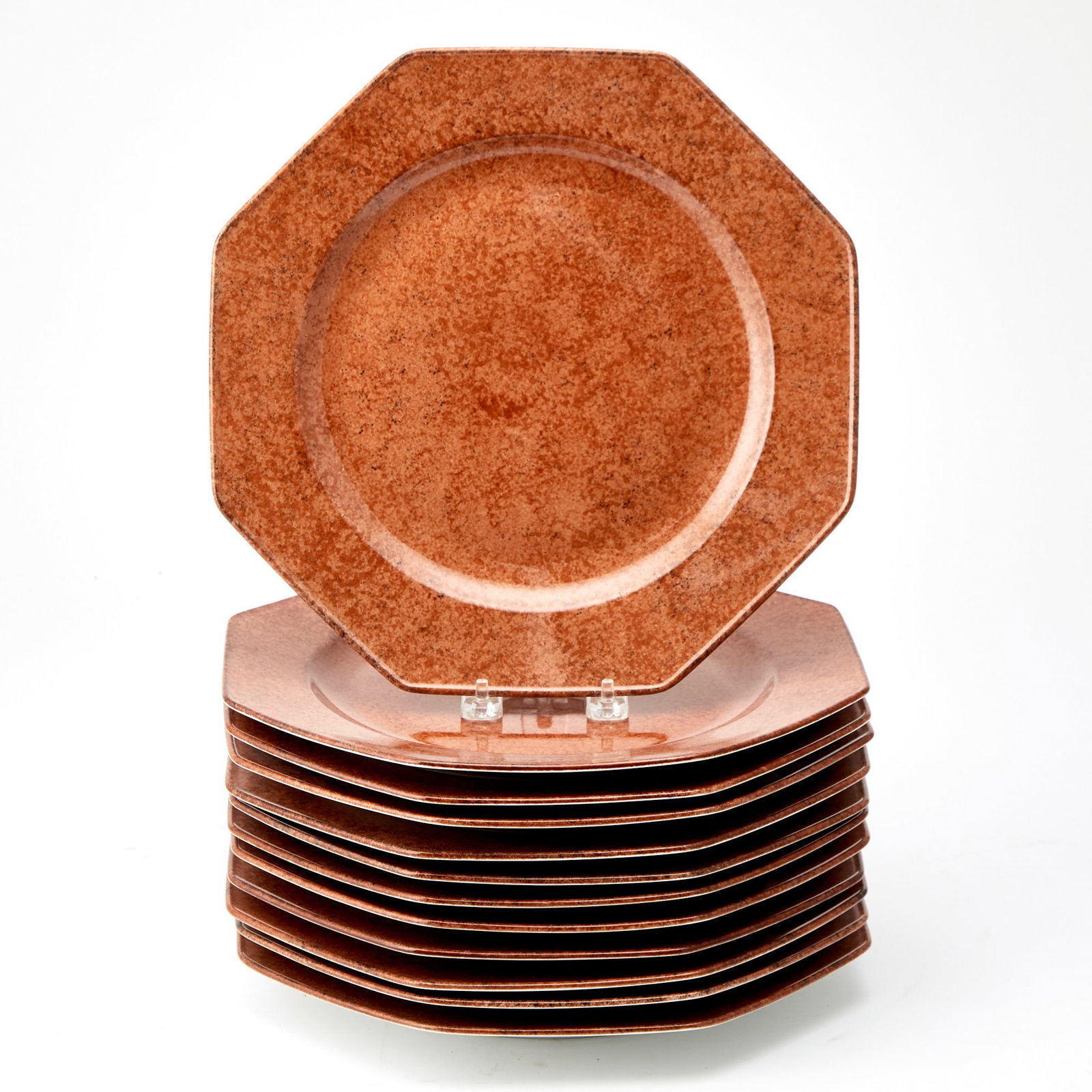 Set of Twelve Limoges Porcelain Octagonal Service Plates: Retailed by Laure Japy, Paris, 20th Century Estate / Collection: The Collection of Joanne B. Breyer Each in all-over mottled rust glaze. Diameter 11 1/2 inches.